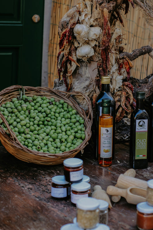 a basket of grapes and bottles