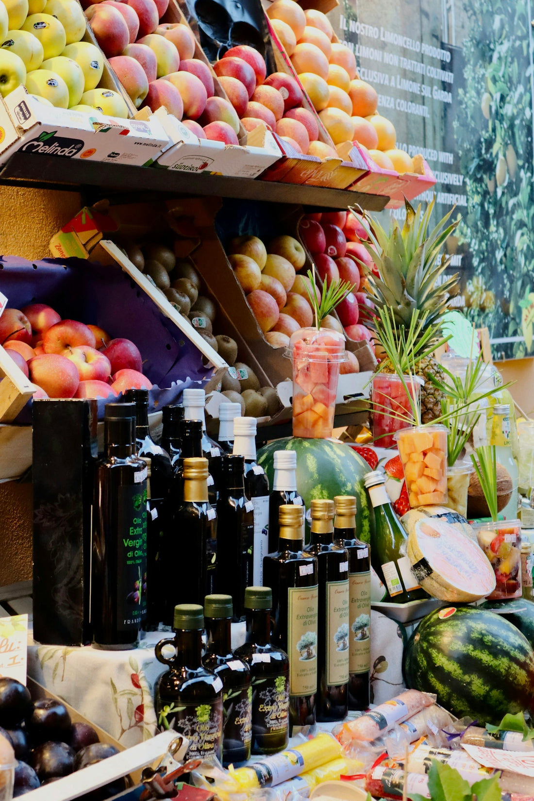 A fruit stand with a variety of fruits and condiments