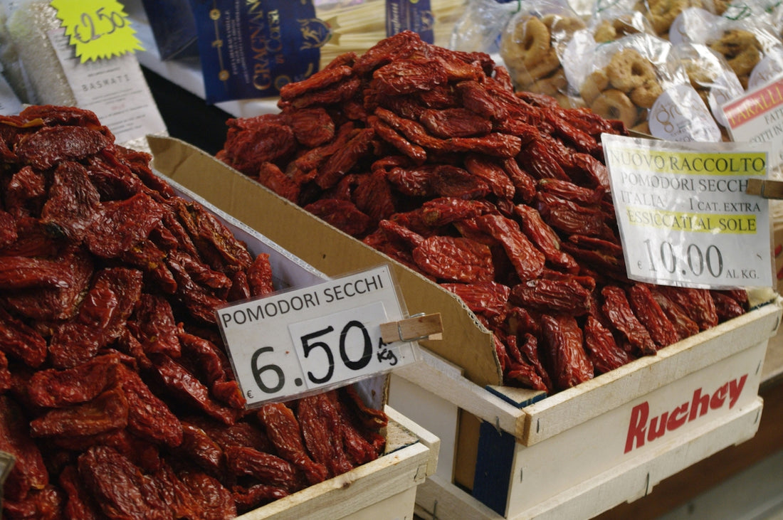 Dried tomatoes are displayed at a market.